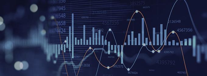 Financial analysts review real-time market data and predictive analytics to guide investment decisions