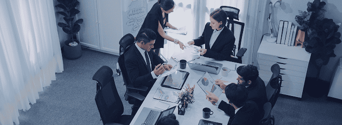 Business process optimization and IT strategy boardroom meeting