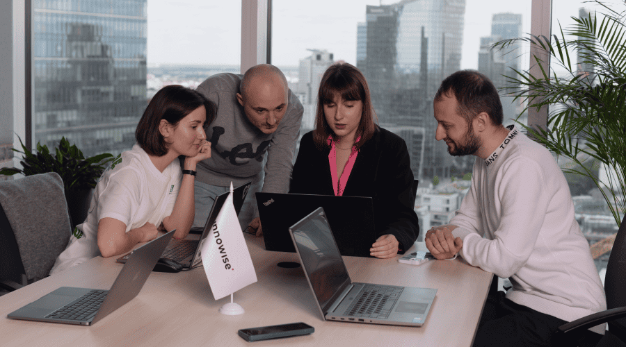 Focused product team holding a brainstorming session in a modern workspace
