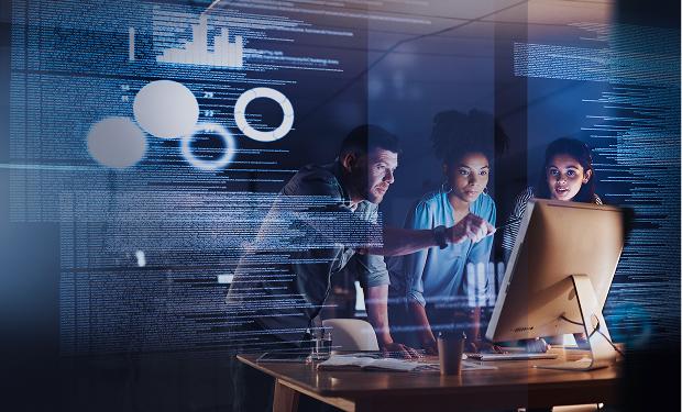 The consulting team reviews analytics on screen, focusing on data-driven IT strategy and solutions