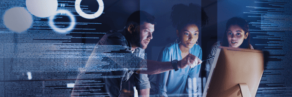 The consulting team reviews analytics on screen, focusing on data-driven IT strategy and solutions