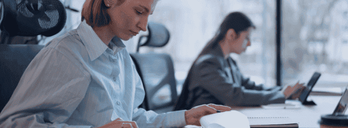 Business analyst evaluating digital transformation strategy with data reports and tablets