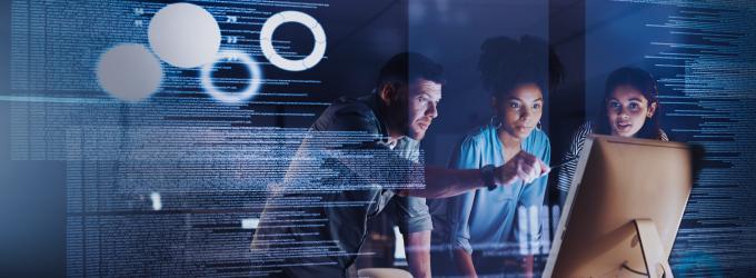 The consulting team reviews analytics on screen, focusing on data-driven IT strategy and solutions