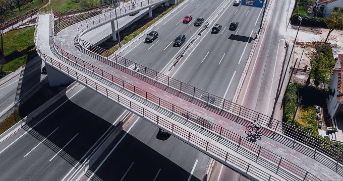 Modern highway with a tech-enabled cycle bridge supports digital mobility and traffic flow optimization