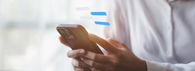 Team member engages in real-time project discussions using a corporate messaging platform on their phone.