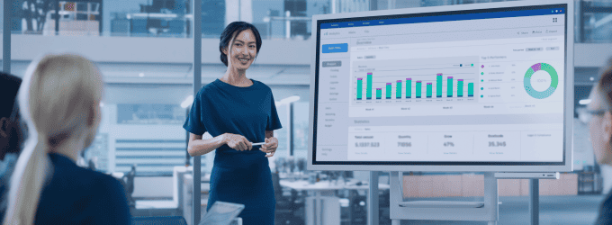 Data analyst presenting business intelligence dashboard insights to IT team