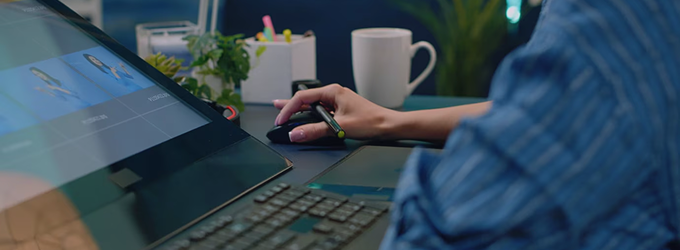 UX specialist creating interface mockups on a digital tablet for app development.